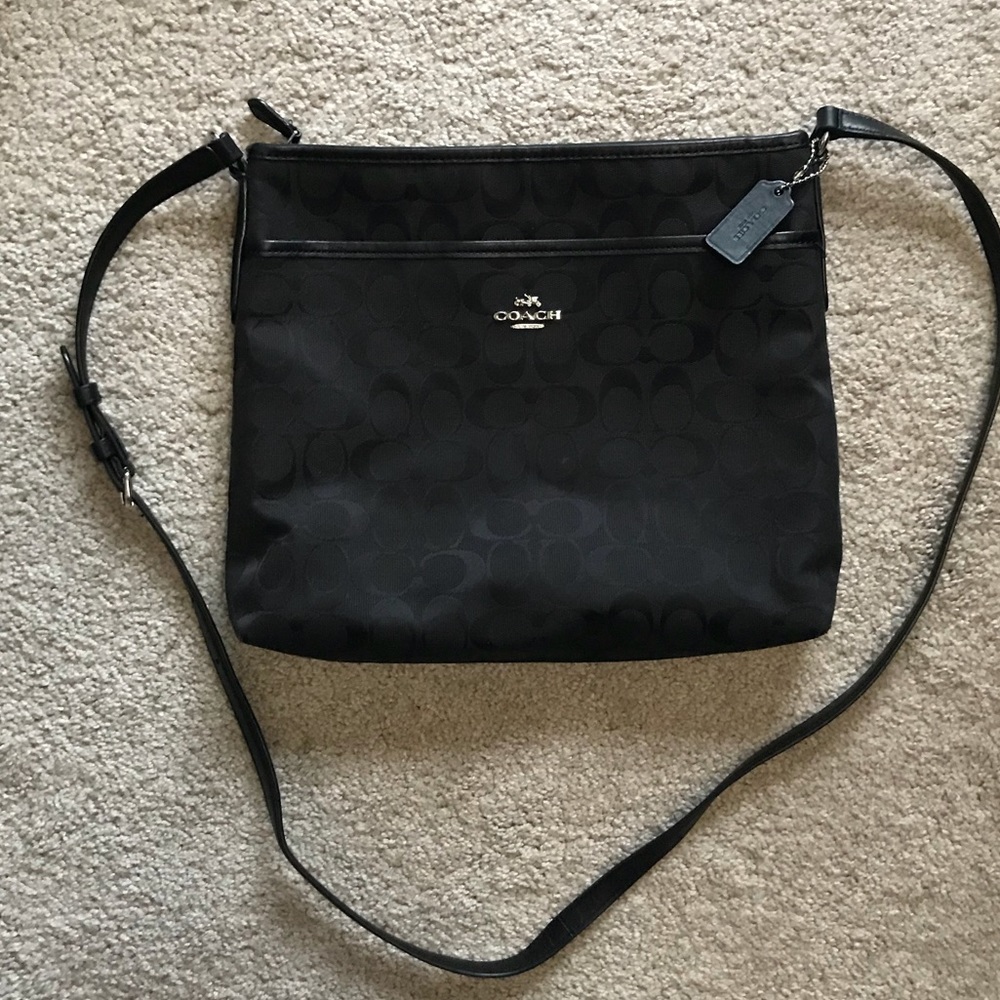 Women’s black Coach purse
